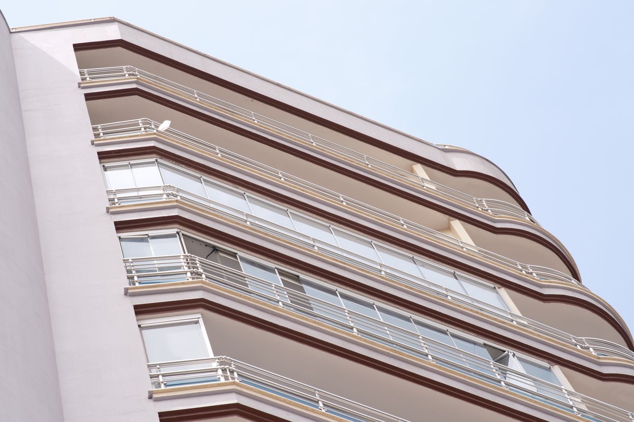 Low angle view of a modern apartment building in İzmir, showcasing residential urban architecture.